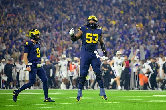 J.J. McCarthy (9) and Trente Jones (53)