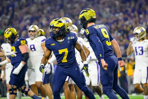 Karsen Barnhart (52), Donovan Edwards (7), and J.J. McCarthy (9)