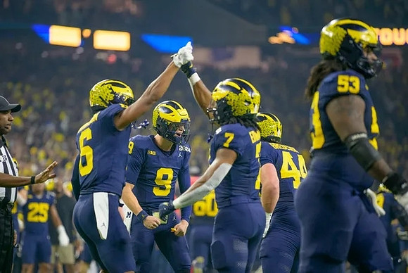 Cornelius Johnson (6), J.J. McCarthy (9), Donovan Edwards (7), Max Bredeson (44), and Trente Jones (53)