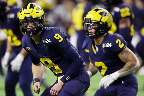 J.J. McCarthy (9) and Blake Corum (2)
