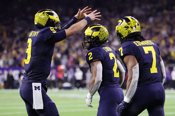 J.J. McCarthy (9), Blake Corum (2), and Donovan Edwards (7)