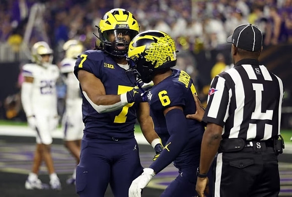 Donovan Edwards (7) and Cornelius Johnson (6)