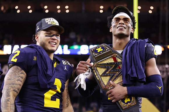 Blake Corum (2) and Rod Moore (9)