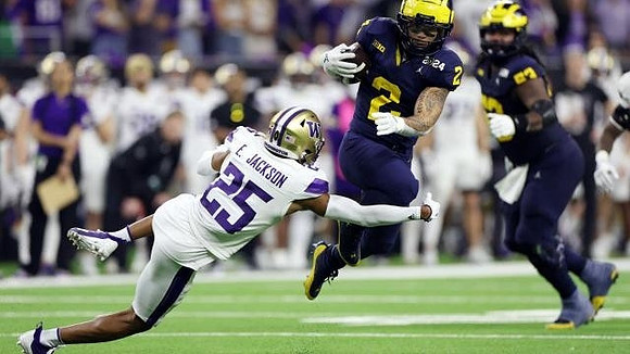 Blake Corum (2) and Trente Jones (53)
