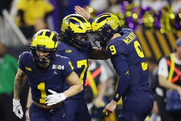 Roman Wilson (1), Donovan Edwards (7), and J.J. McCarthy (9)