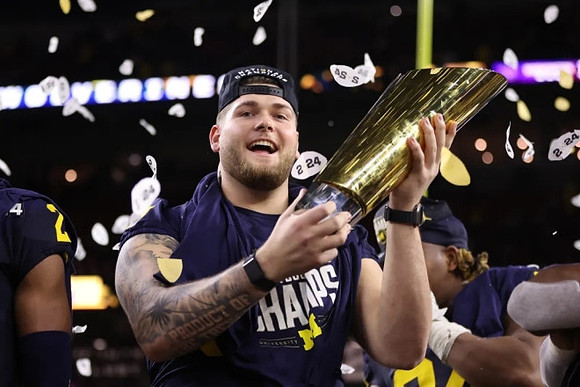 Zak Zinter (65) and National Championship Trophy