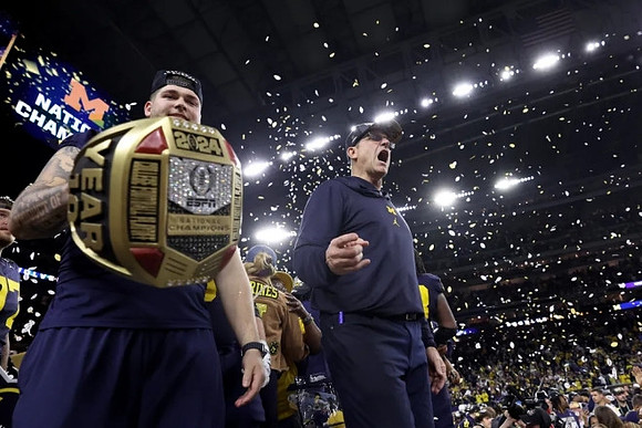 Zak Zinter (65) and Jim Harbaugh