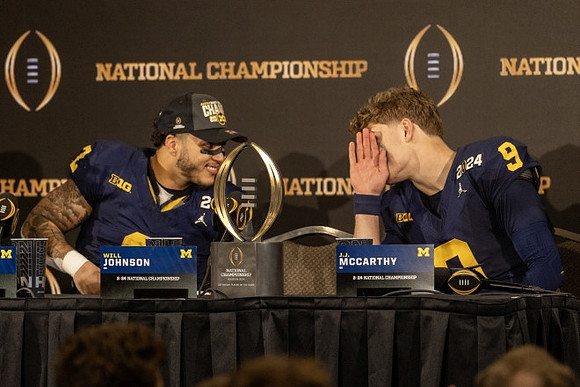 Will Johnson (2) and J.J. McCarthy (9)