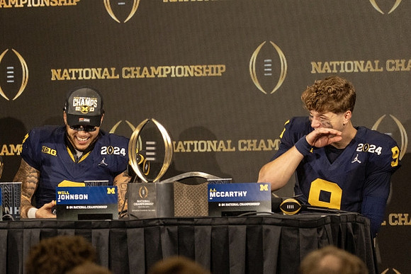 Will Johnson (2) and J.J. McCarthy (9)