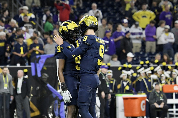 Rod Moore (9) and J.J. McCarthy (9)