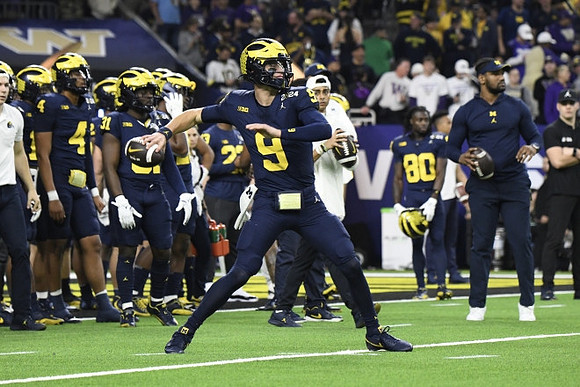 J.J. McCarthy (9) and Michigan Team