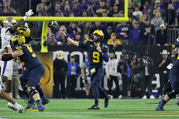 Karsen Barnhart (52) and J.J. McCarthy (9)