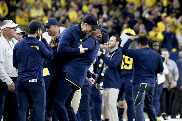 Jesse Minter, Jim Harbaugh, and Sherrone Moore