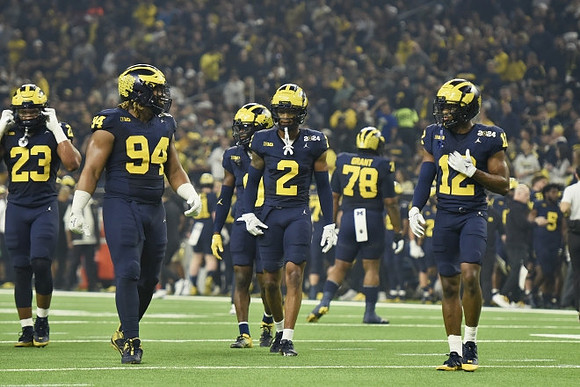 Michael Barrett (23), Kris Jenkins (94), Mike Sainristil (0), Will Johnson (2), Kenneth Grant (78), and Josh Wallace (12)