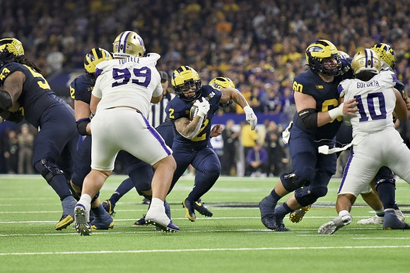 Trente Jones (53), Karsen Barnhart (52), Blake Corum (2), and Drake Nugent (60)