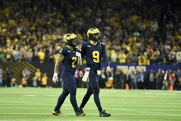 Blake Corum (2) and J.J. McCarthy (9)