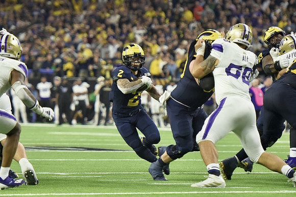 Blake Corum (2) and LaDarius Henderson (73)