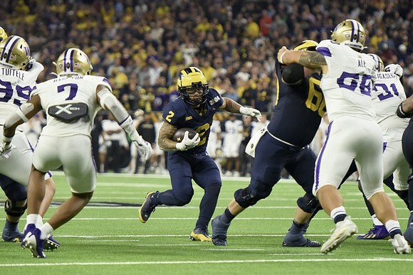 Blake Corum (2) and Drake Nugent (60)
