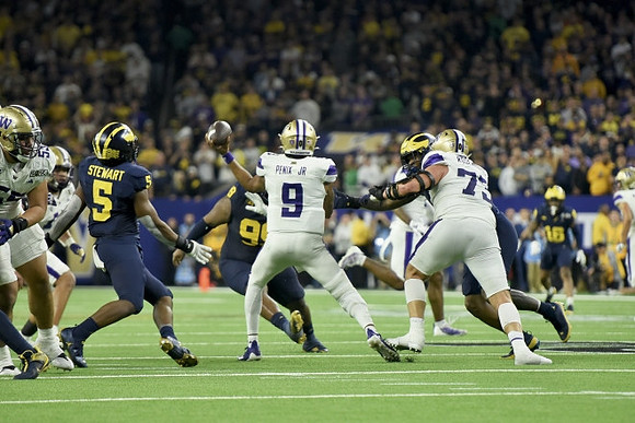 Josaiah Stewart (5) and Cam Goode (99)