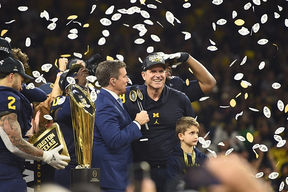 Blake Corum (2), Jim Harbaugh, and National Championship Trophy