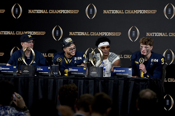 Jim Harbaugh, Blake Corum (2), Will Johnson (2), and J.J. McCarthy (9)