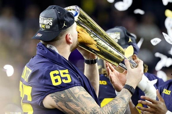 Zak Zinter (65) and National Championship Trophy