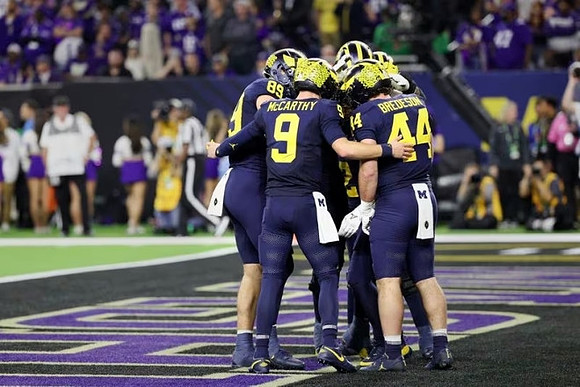 AJ Barner (89), J.J. McCarthy (9), and Max Bredeson (44)