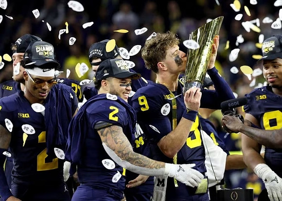 Will Johnson (2), Blake Corum (2), J.J. McCarthy (9), Kris Jenkins (94), and National Championship Trophy