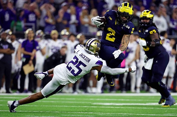 Blake Corum (2) and Trente Jones (53)