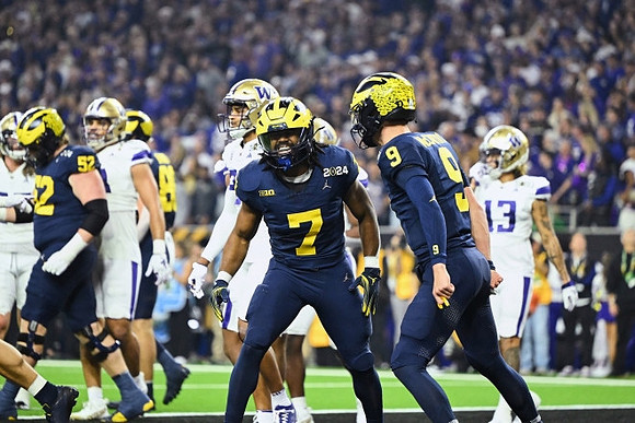 Karsen Barnhart (52), Donovan Edwards (7), and J.J. McCarthy (9)