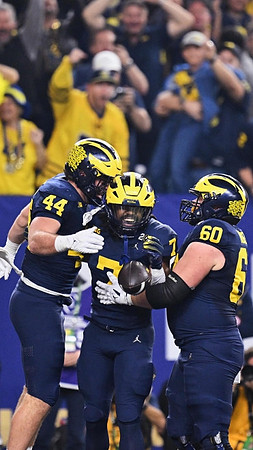 Max Bredeson (44), Donovan Edwards (7), and Drake Nugent (60)