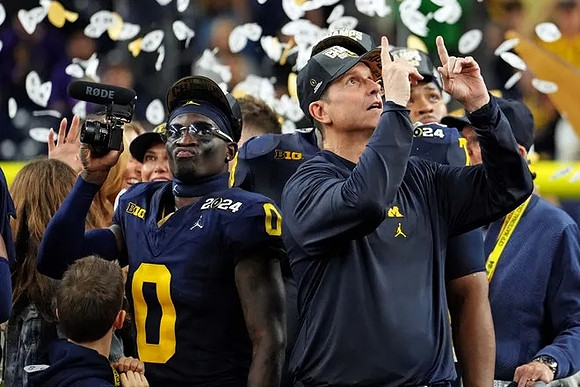 Mike Sainristil (0) and Jim Harbaugh