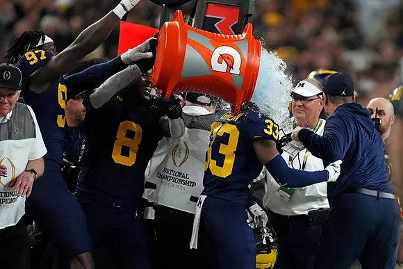 Chibi Anwunah (97), Derrick Moore (8), German Green (33), and Jim Harbaugh