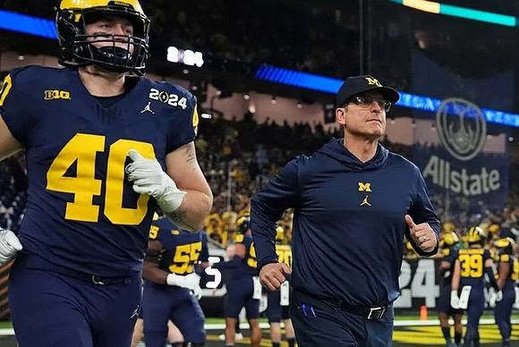 Christian Boivin (40) and Jim Harbaugh