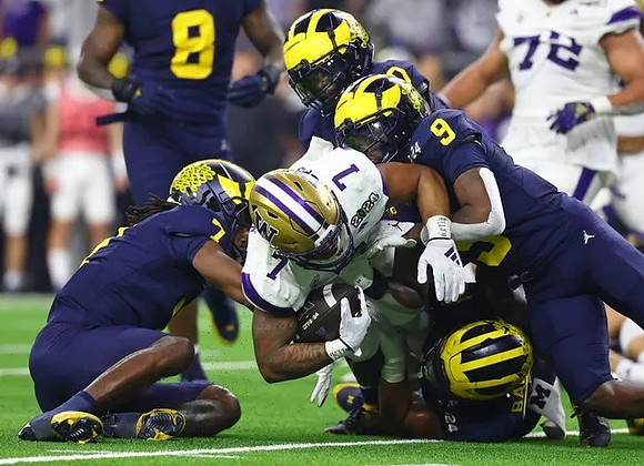 Makari Paige (7), Derrick Moore (8), Michael Barrett (23), Rod Moore (9), and Mike Sainristil (0)
