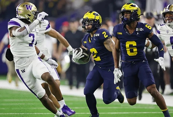 Blake Corum (2) and Cornelius Johnson (6)