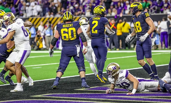 Drake Nugent (60), Blake Corum (2), and Colston Loveland (18)