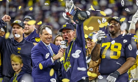 Jim Harbaugh, Zak Zinter (65), Jack Harbaugh, and Kenneth Grant (78)