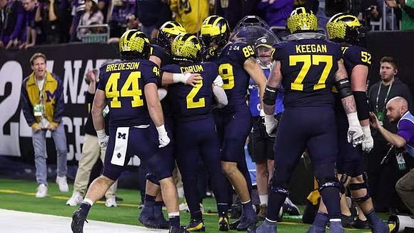 Max Bredeson (44), Blake Corum (2), AJ Barner (89), Trevor Keegan (77), and Karsen Barnhart (52)