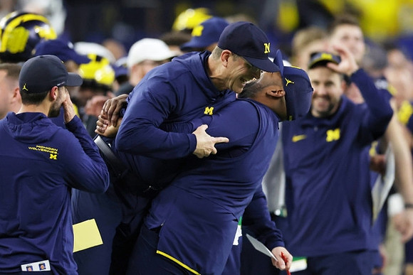 Jesse Minter, Jim Harbaugh, and Sherrone Moore