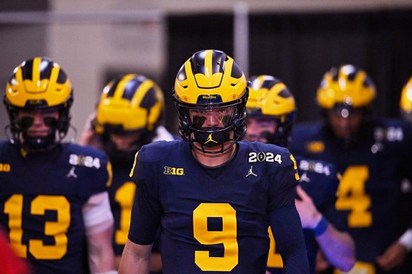Jack Tuttle (13) and J.J. McCarthy (9)