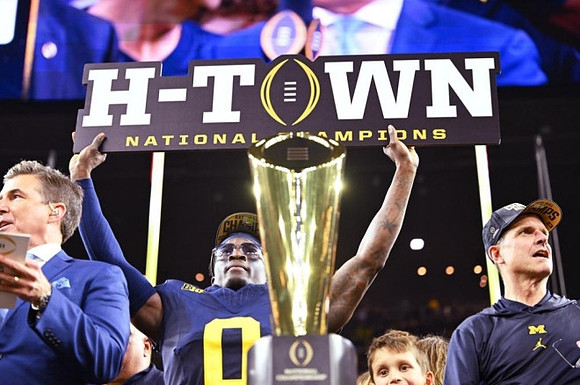 Mike Sainristil (0), Jim Harbaugh, and National Championship Trophy