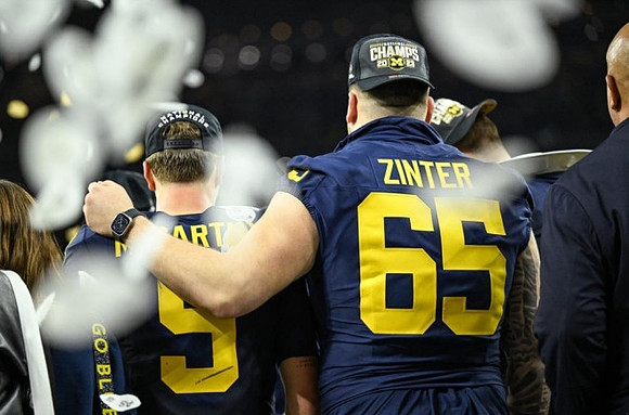 J.J. McCarthy (9) and Zak Zinter (65)