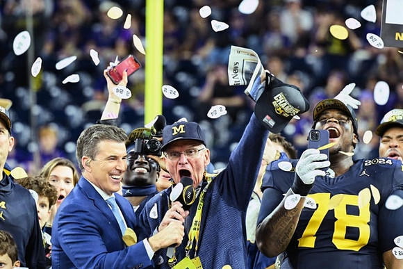 Jack Harbaugh, Mike Sainristil (0), and Kenneth Grant (78)