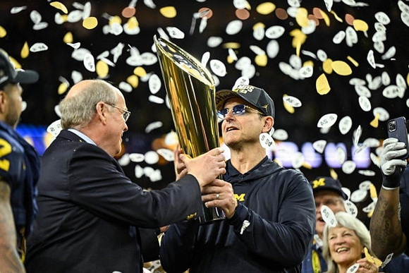 Blake Corum (2), Jim Harbaugh, and National Championship Trophy
