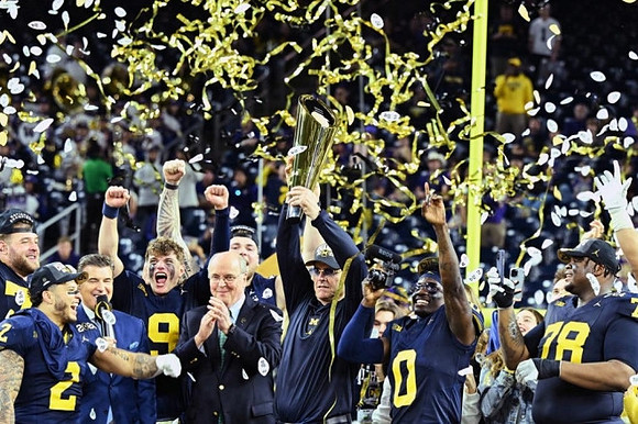 Trevor Keegan (77), Blake Corum (2), J.J. McCarthy (9), Zak Zinter (65), Jim Harbaugh, Mike Sainristil (0), and Kenneth Grant (78)