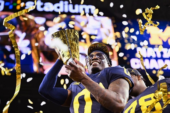 Mike Sainristil (0) and National Championship Trophy