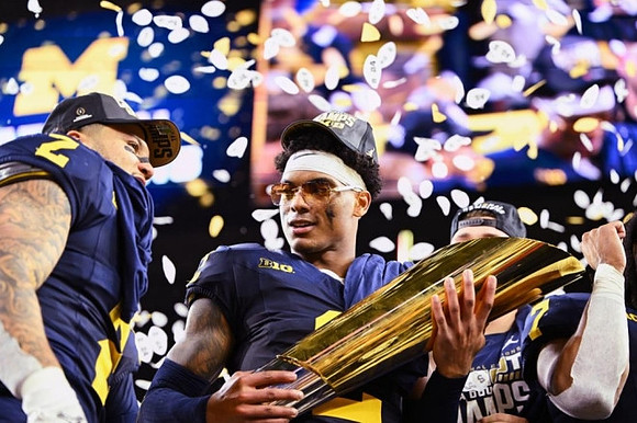 Blake Corum (2), Will Johnson (2), and National Championship Trophy