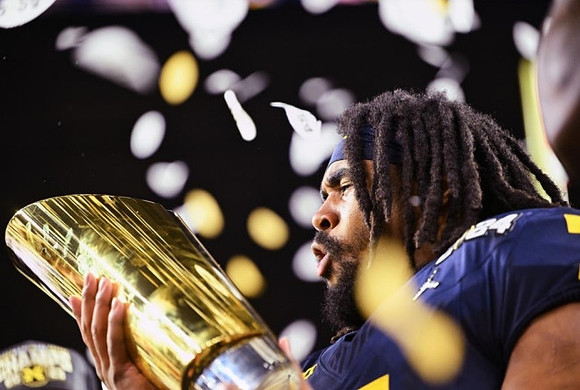 Donovan Edwards (7) and National Championship Trophy
