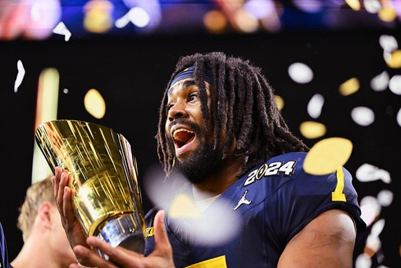 Donovan Edwards (7) and National Championship Trophy